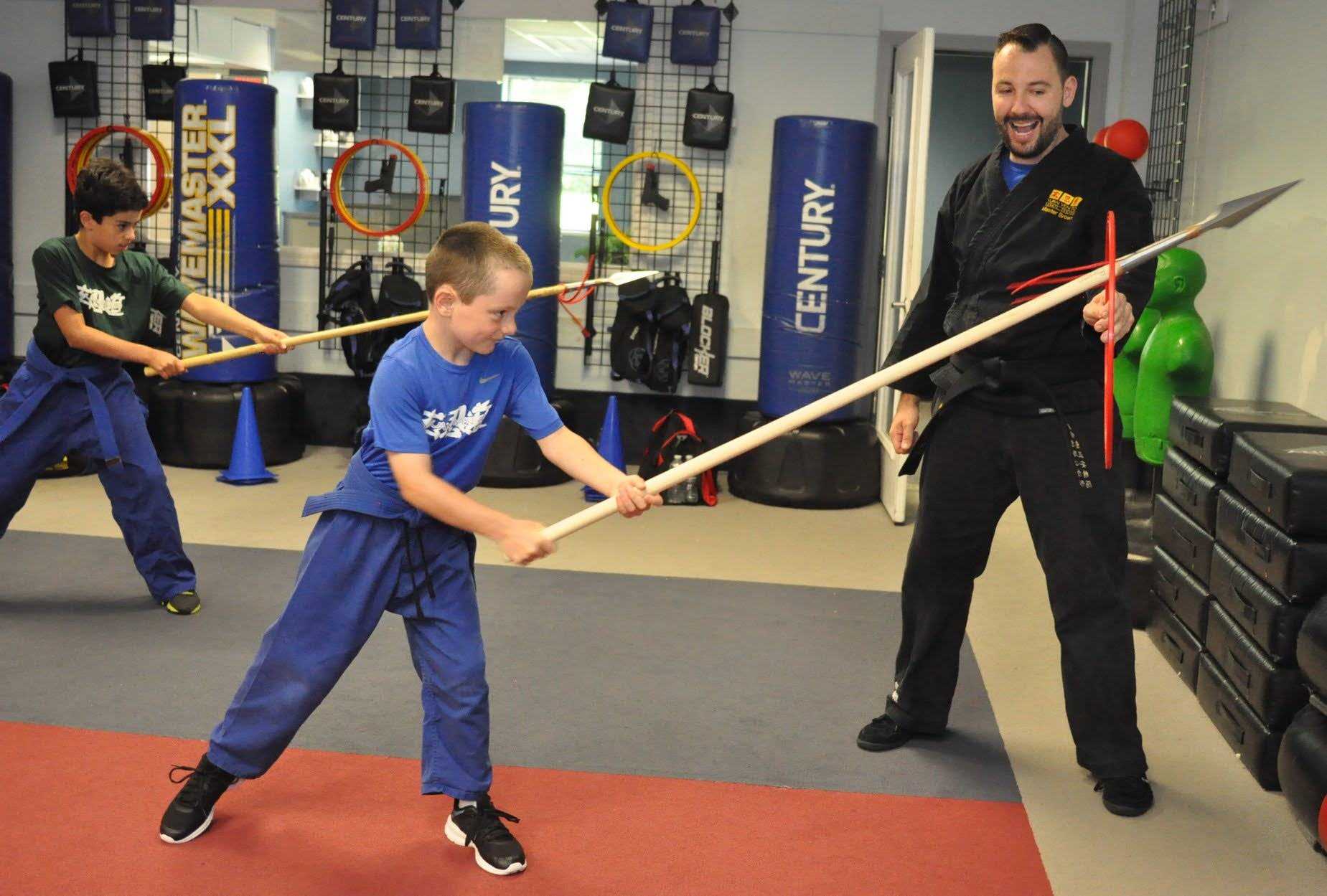 Yuan Yen Do students practicing spear forms